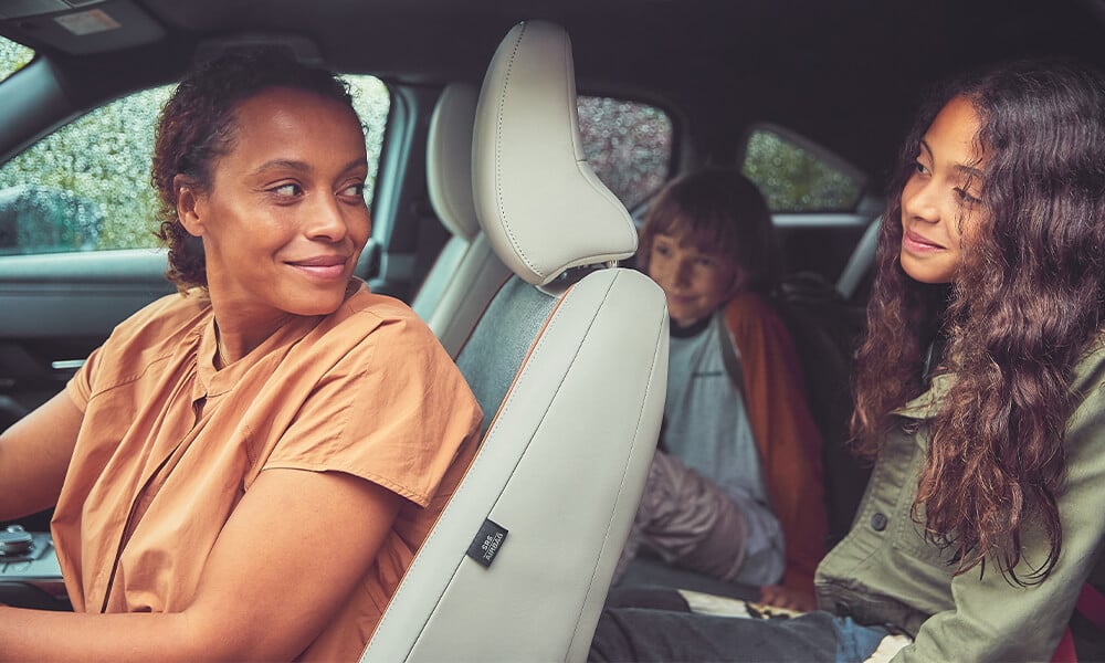 Family in a Mazda with quote from Mazda President 