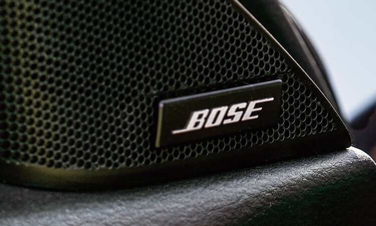 Close-up of driver’s side neodymium tweeter with Bose logo.