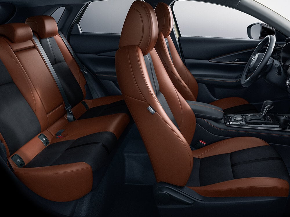 Unobstructed view from passenger’s side inside the CX-30 with Terracotta coloured seating.  