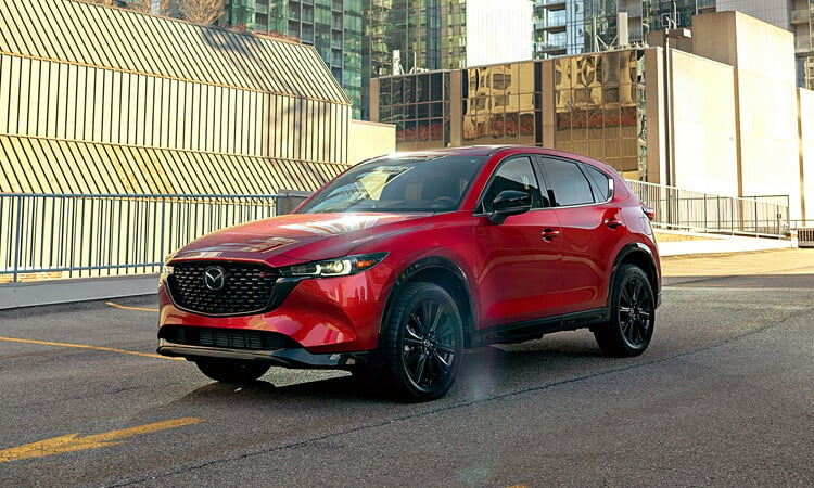 Soul Red Crystal Metallic CX-5 parked on parking structure’s top floor in daylight