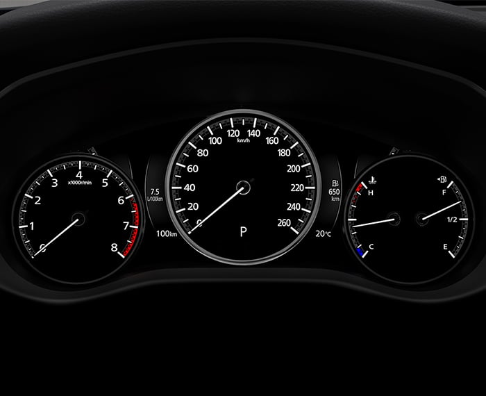 CX-50 digital dash displays speedometer dial, as well as RPM dial, and temperature/fuel gauges. 