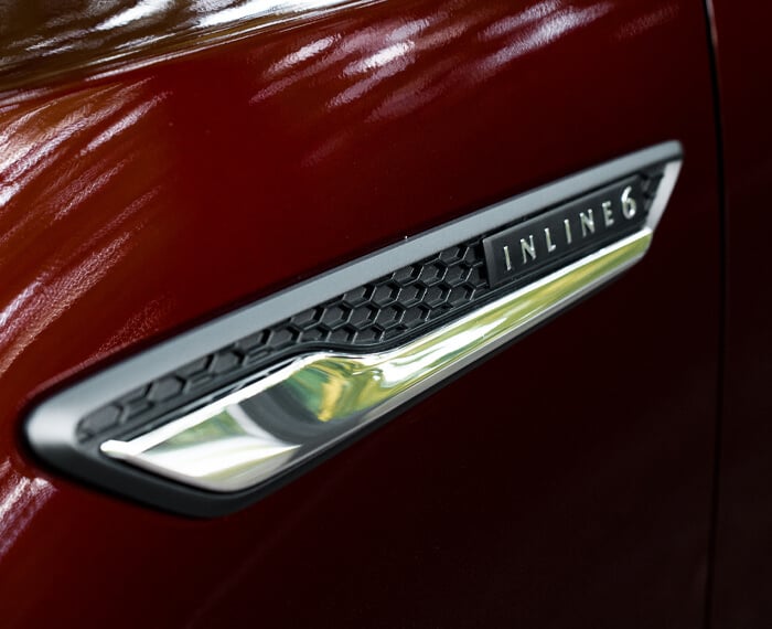 Close-up of Inline 6 Turbo Vehicle badge.