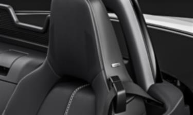 Image of MX-5 RF car seat headrest with integrated audio system. 