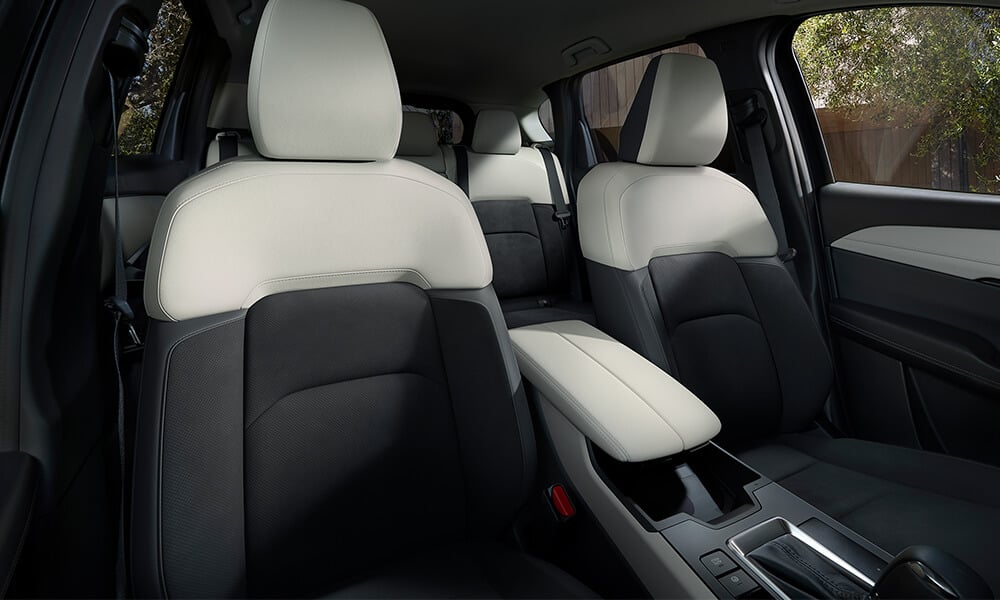 Looking into the Mazda CX-5 from the front passenger side, showing the front seats.
